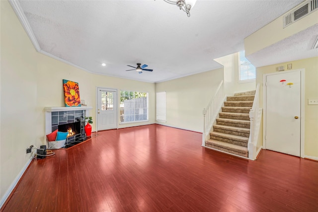 living room featuring hardwood / wood-style floors, a healthy amount of sunlight, and a textured ceiling