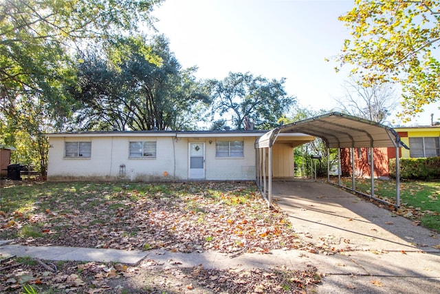 ranch-style home with a carport