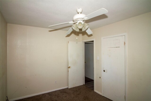 unfurnished bedroom with ceiling fan and carpet floors