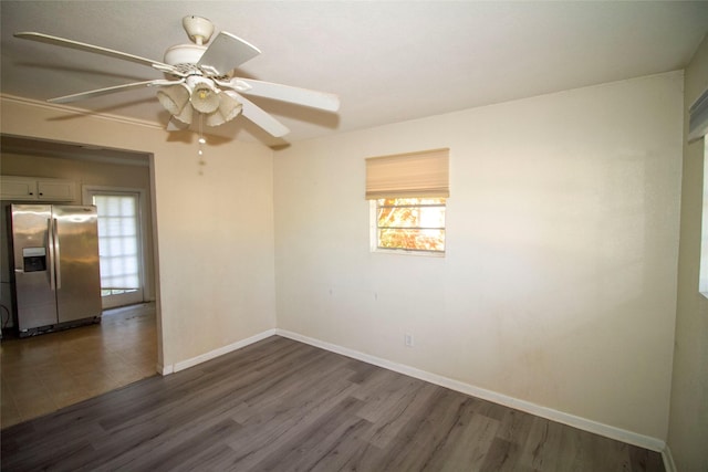 empty room with dark wood-type flooring and ceiling fan