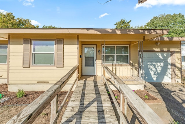 view of front of property featuring covered porch and a garage