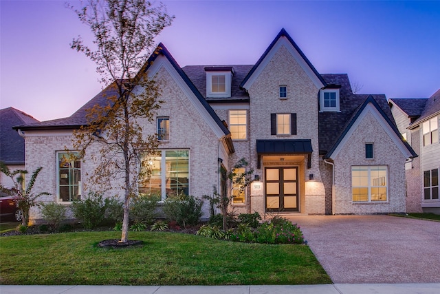 view of front of property with a yard