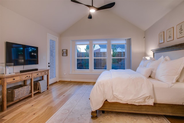 bedroom featuring ceiling fan, high vaulted ceiling, and light hardwood / wood-style flooring