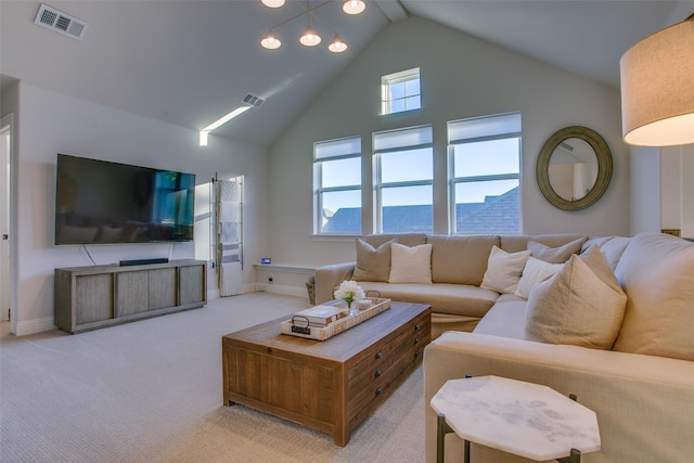 carpeted living room with high vaulted ceiling and a healthy amount of sunlight