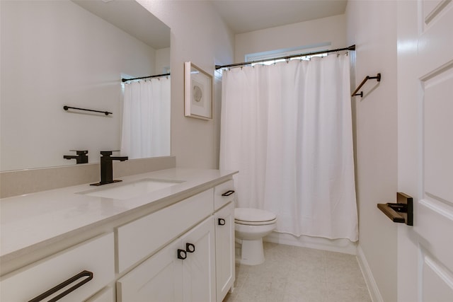 full bathroom with vanity, shower / tub combo with curtain, tile patterned floors, and toilet