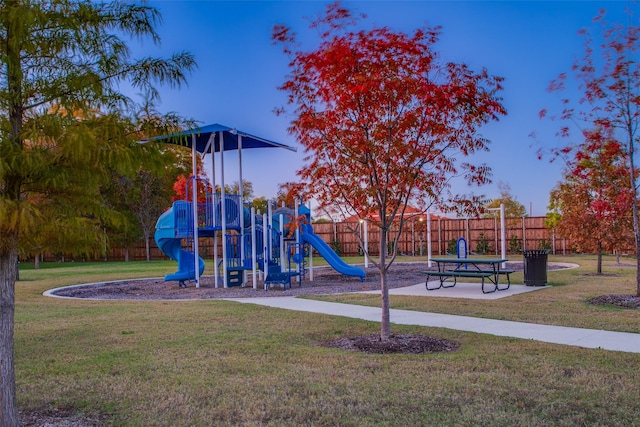 view of playground featuring a lawn