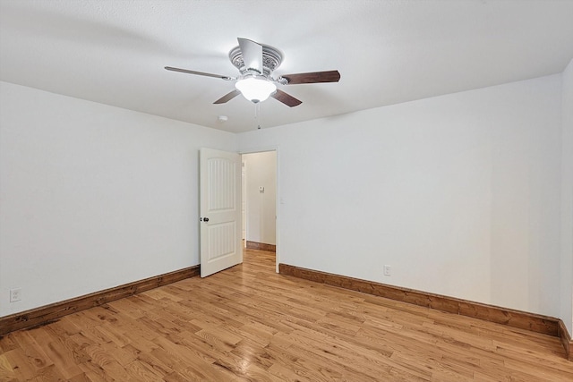 empty room with light hardwood / wood-style flooring