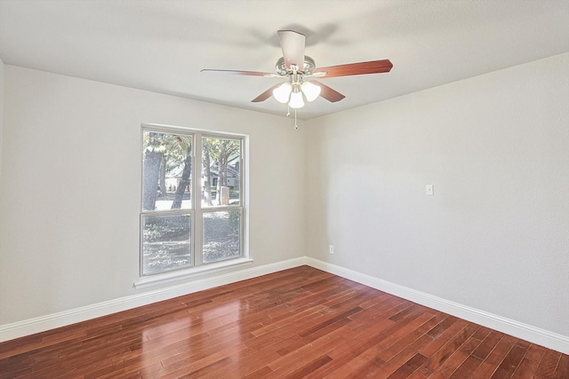 empty room with ceiling fan and wood-type flooring