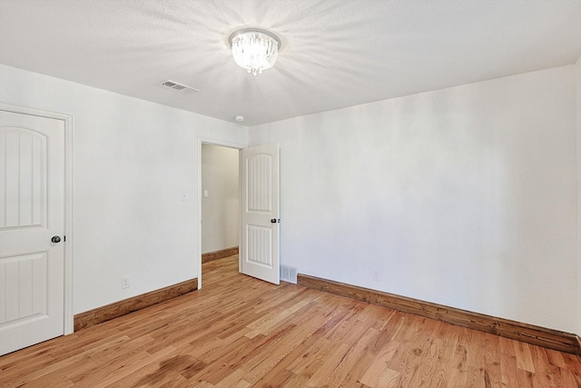 empty room featuring light wood-type flooring