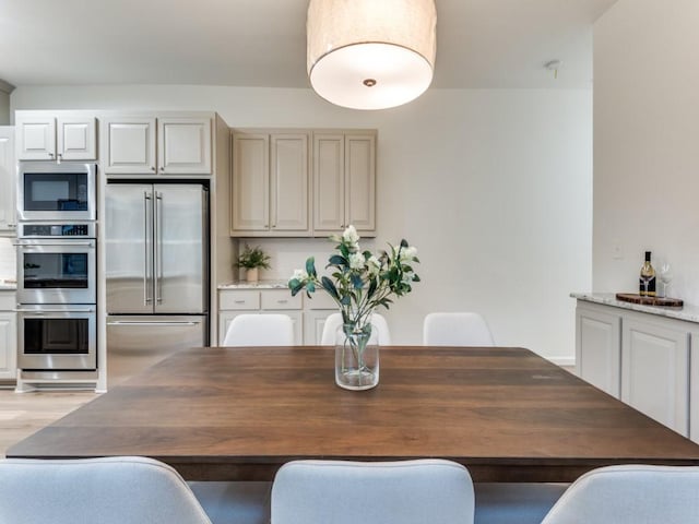 dining area with light hardwood / wood-style floors