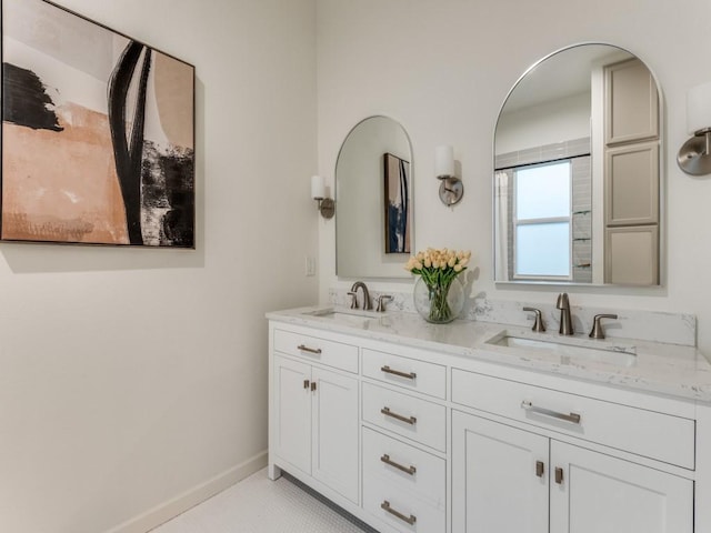 bathroom with tile patterned flooring and vanity