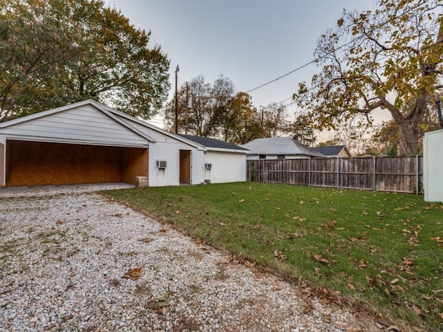 garage featuring a lawn