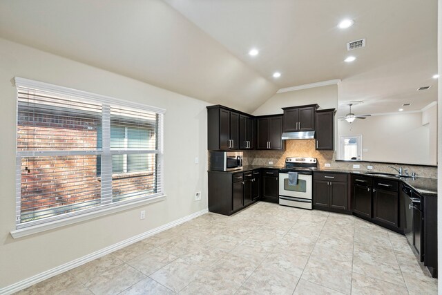 kitchen with appliances with stainless steel finishes, backsplash, ceiling fan, sink, and lofted ceiling