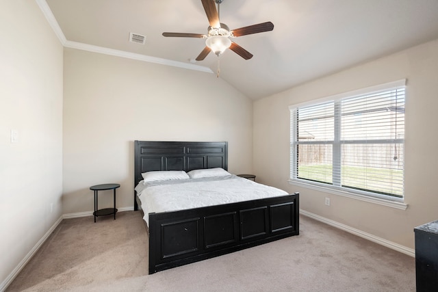 bedroom featuring light carpet, lofted ceiling, ceiling fan, and ornamental molding