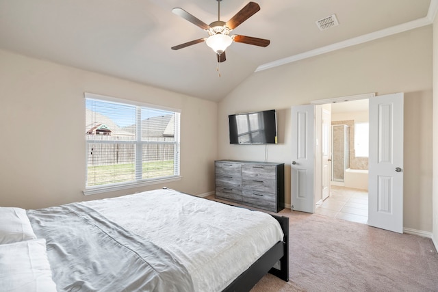 carpeted bedroom with ceiling fan, ensuite bathroom, crown molding, and vaulted ceiling