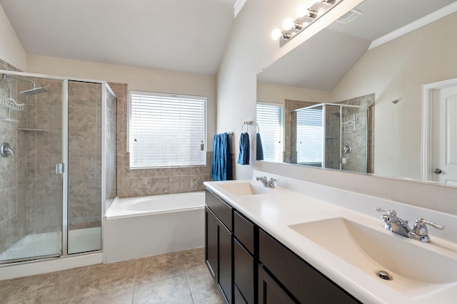 bathroom with tile patterned flooring, vanity, independent shower and bath, and vaulted ceiling