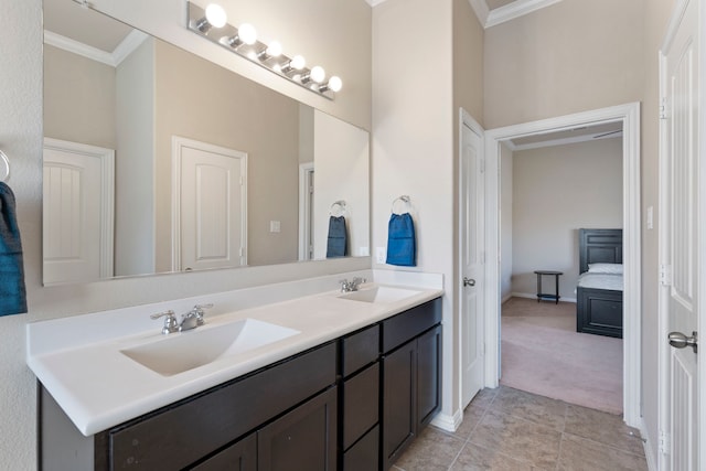 bathroom featuring crown molding, tile patterned flooring, and vanity