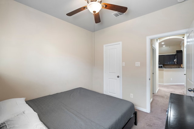 carpeted bedroom with ceiling fan