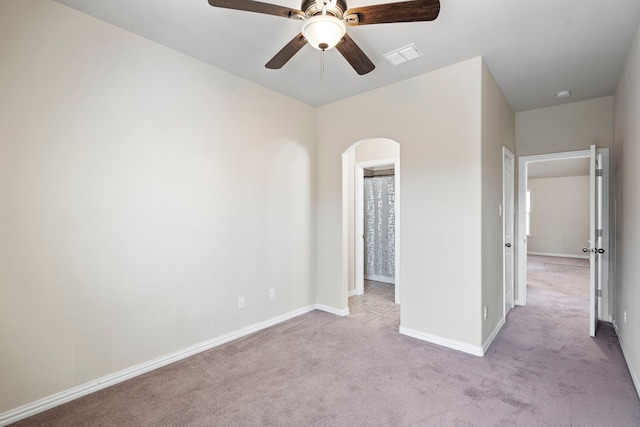 unfurnished bedroom with light colored carpet and ceiling fan