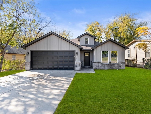 view of front of home featuring a garage and a front lawn