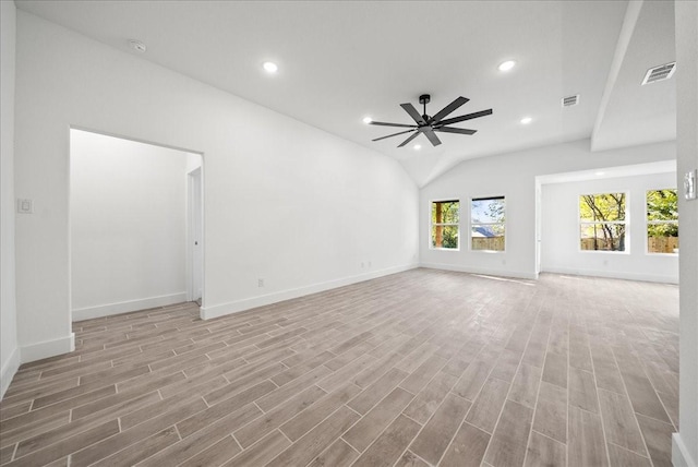 unfurnished living room with ceiling fan, vaulted ceiling, and light hardwood / wood-style flooring