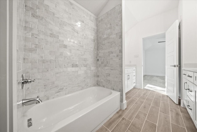 bathroom featuring vanity and vaulted ceiling