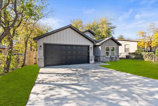 view of front facade with a front lawn and a garage