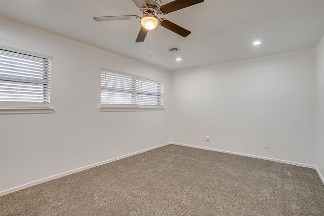 carpeted empty room with ceiling fan