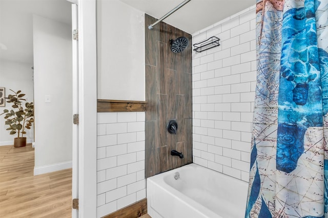 603 Lilly St, Cleburne, TX 76033 - full bathroom featuring shower / bath combo, wood finished floors, and baseboards