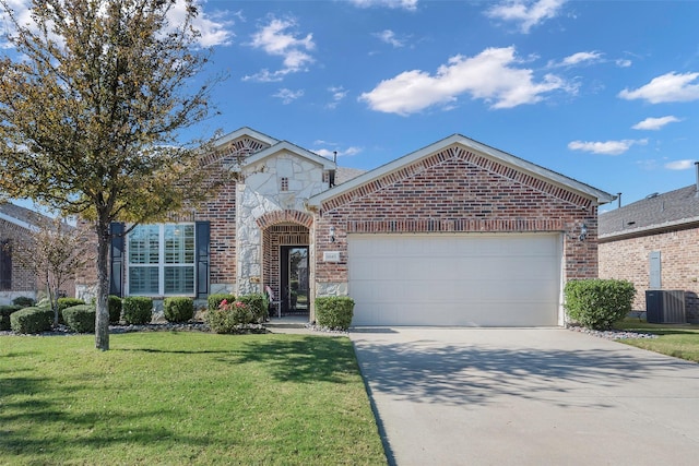 view of front of home featuring cooling unit, a garage, and a front lawn