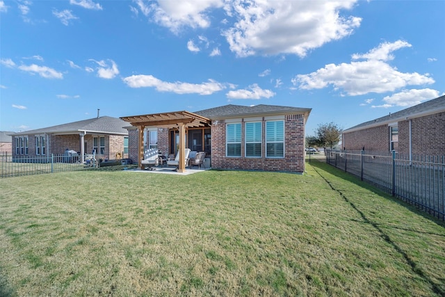 back of house featuring a yard, a pergola, and a patio area