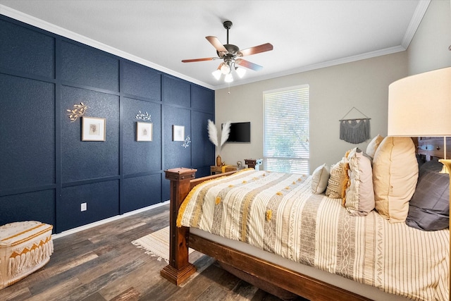 bedroom featuring ceiling fan, ornamental molding, and dark hardwood / wood-style floors