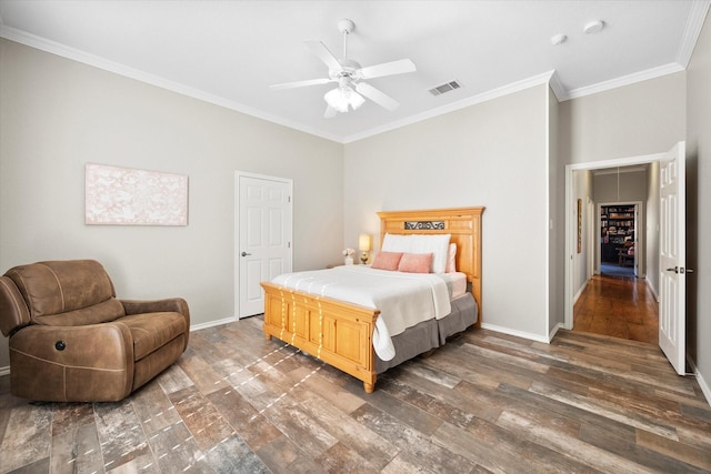 bedroom featuring ornamental molding, ceiling fan, and dark hardwood / wood-style flooring