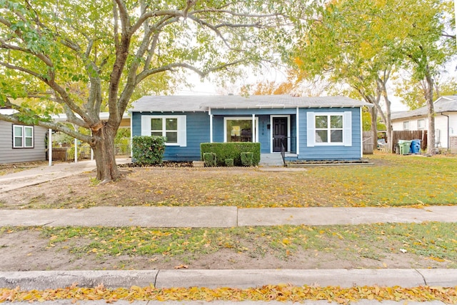 ranch-style home with a front lawn