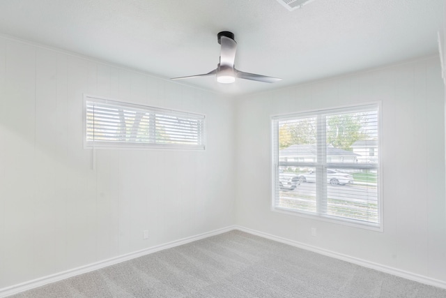 empty room with carpet floors and ceiling fan