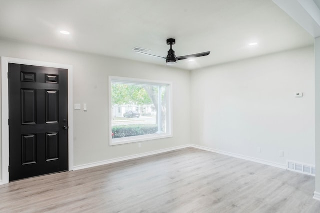 entrance foyer with ceiling fan and light hardwood / wood-style flooring