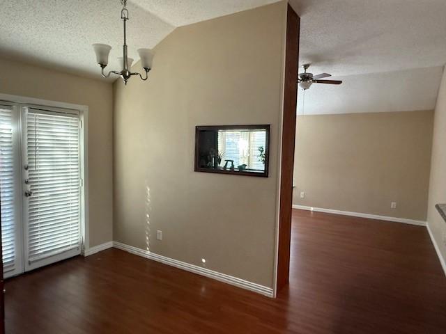 unfurnished bedroom with a closet, hardwood / wood-style flooring, ceiling fan, and lofted ceiling