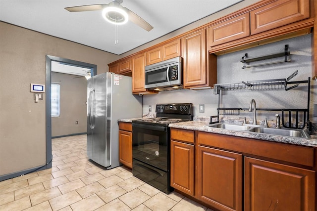 kitchen with ceiling fan, sink, and appliances with stainless steel finishes