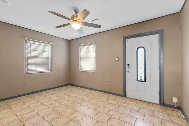 entryway featuring ceiling fan