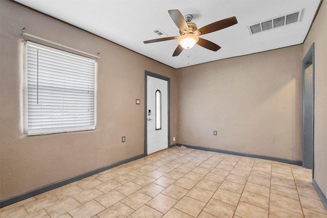 spare room featuring ceiling fan