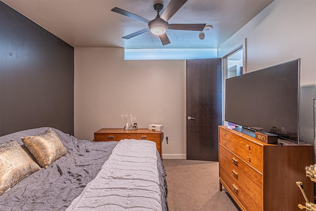 bedroom with ceiling fan and light colored carpet