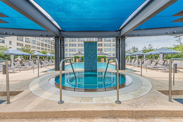 view of swimming pool featuring a gazebo and a hot tub