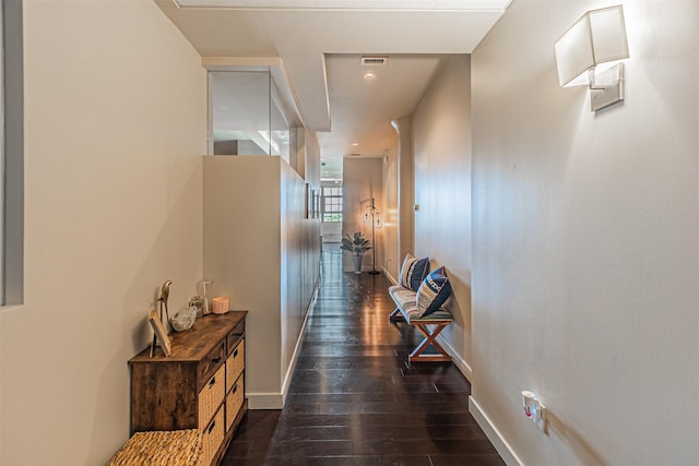 hallway featuring dark hardwood / wood-style flooring