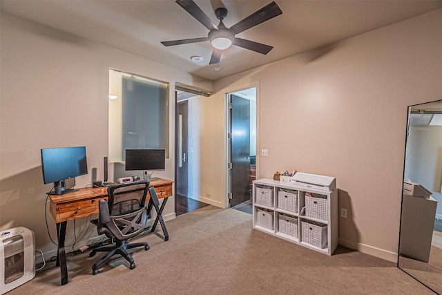 office area with ceiling fan and carpet