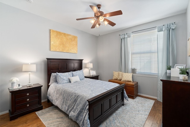 bedroom with hardwood / wood-style flooring and ceiling fan