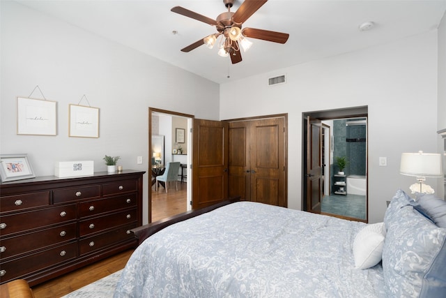 bedroom with ceiling fan and wood-type flooring