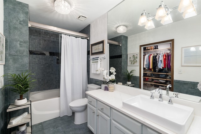 full bathroom featuring tile patterned flooring, shower / bath combo, toilet, and vanity