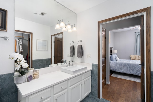 bathroom featuring hardwood / wood-style floors and vanity