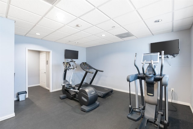 workout room featuring a drop ceiling