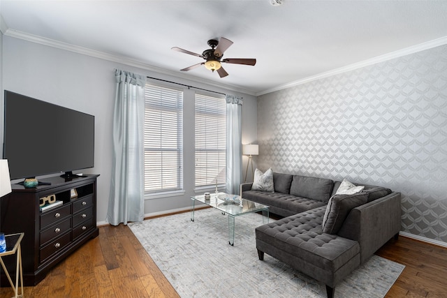 living room featuring ceiling fan, ornamental molding, and dark wood-type flooring